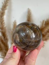 Load image into Gallery viewer, Peach and Black Moonstone Sphere
