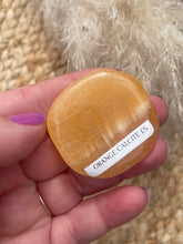 Load image into Gallery viewer, Orange Calcite Smoothie Palm Stone
